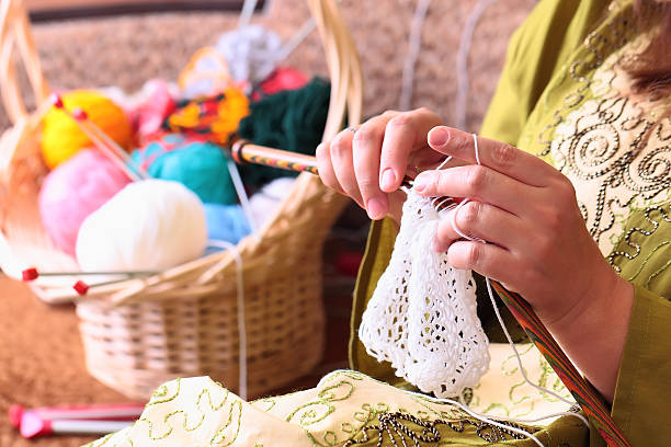 istock woman hands knitting 524907317