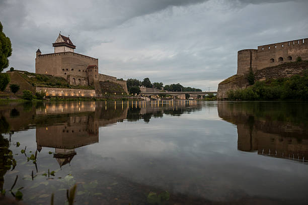 Aerial view of Koknese medieval castle ruins on the bank of Daugava river. Koknese Castle dating from the 13th century. The castle was situated on a high bluff overlooking the Daugava river valley. In 1965 a hydroelectric dam was built downriver, creating a reservoir That partially submerged flooded the castle and the surrounding valley.