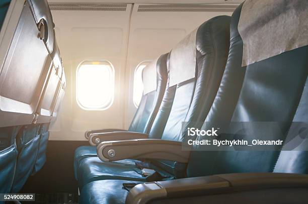 Interior Of Airplane With Empty Seats And Sunlight At The Stock Photo - Download Image Now