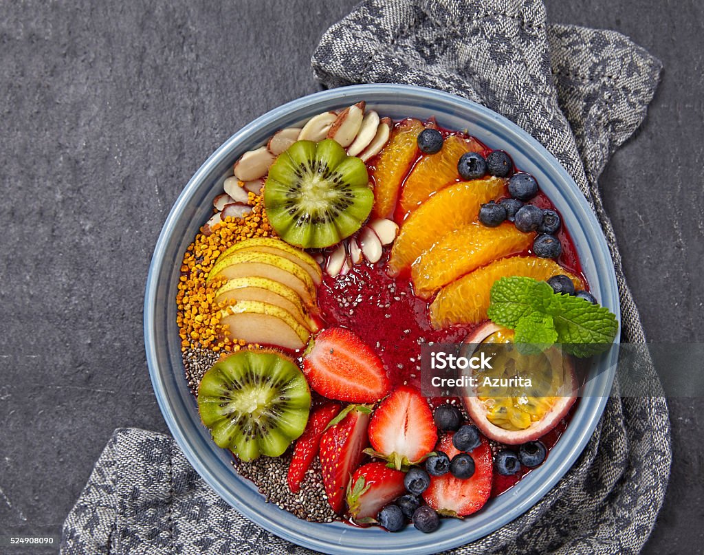 Acai smoothie bowl Acai smoothie bowl topped with fruits and berries Backgrounds Stock Photo