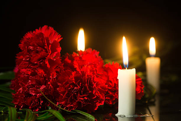 istock candles and red flowers 524908114
