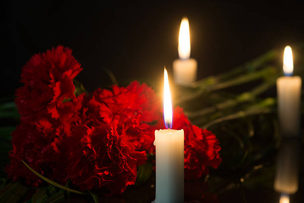 istock candles and red flowers 524908162