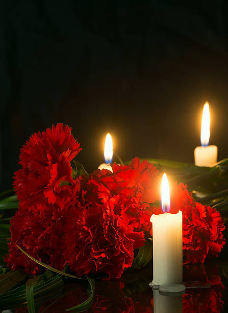 istock candles and red flowers 524908204