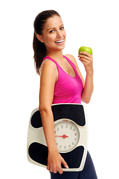 weightloss mujer - weight scale apple comparison balance fotografías e imágenes de stock