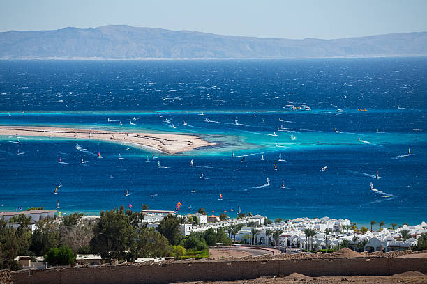 Dahab Lagoon full of windsurfers in the town of Dahab, Egypt dahab photos stock pictures, royalty-free photos & images
