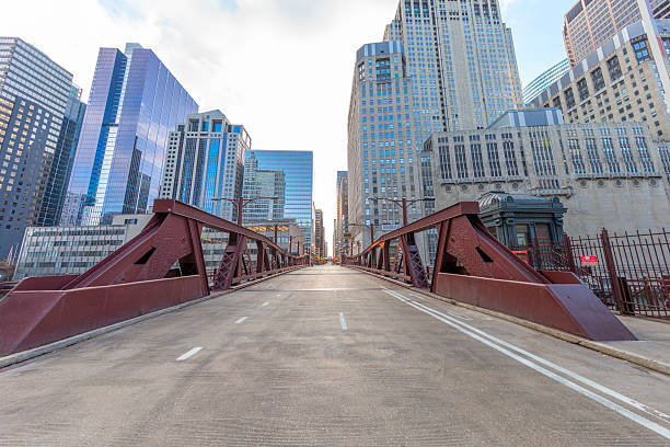 Downtown Chicago and Bridge on the Chicago River Downtown Chicago in the morning. aon center chicago photos stock pictures, royalty-free photos & images