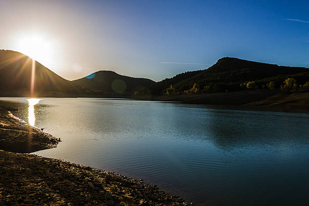 istock lake with green trees in Navarra Spain 524924211