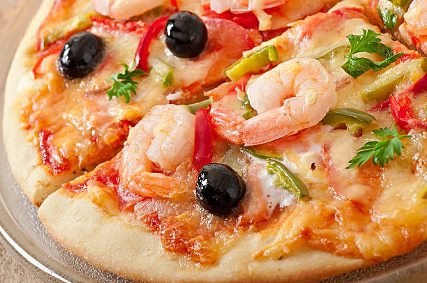 istock Pizza with shrimp, salmon and olives 524924213