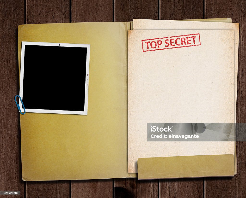 Top secret folder. folder with TOP SECRET stamped across the front page and a blank photograph File Folder Stock Photo