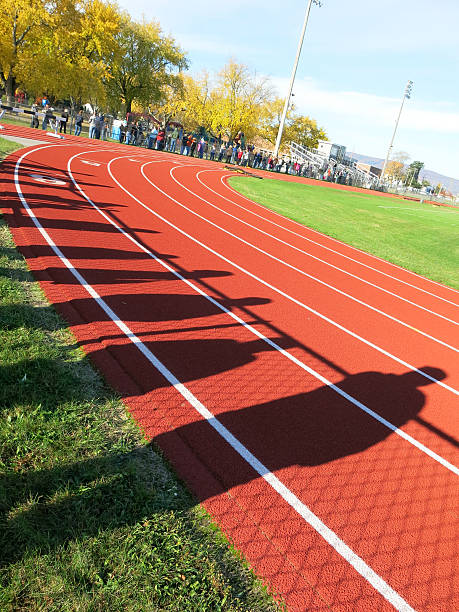 istock Spectator Crowds and People's Shadows on Running Track at School 524924293