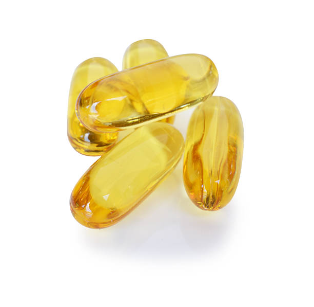 istock Cod liver oil omega 3 gel capsules isolated on white 524924311