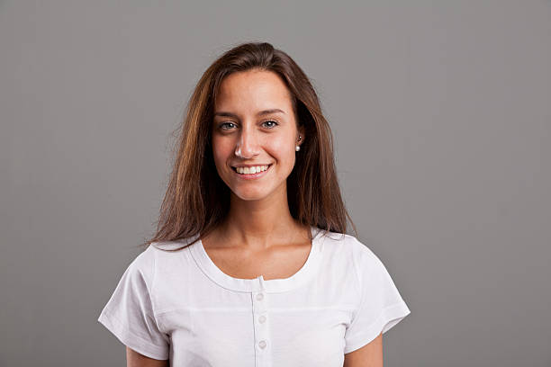 istock beautiful tanned brunette smiling 524927513