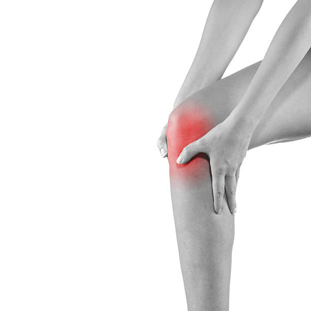 istock Woman holding injured knee. 524942103
