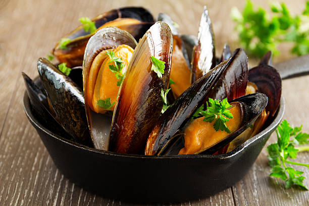 istock Mussels cooked in wine with parsley. 524942631