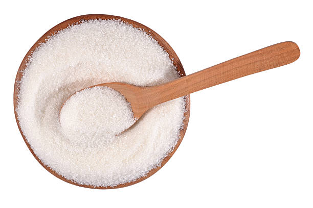 istock White sugar in a wooden bowl on a white 524943471