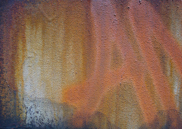 istock spray-paint orange graffiti tag on grunge rusty metal surface 524945819