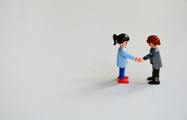 Alcobendas, Spain - August 3, 2014: Woman and a man shake his hands after reaching an agreement. 