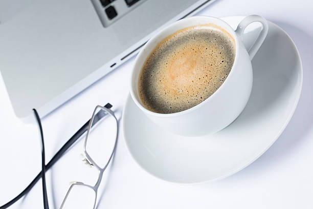 istock Cup of coffee with a keyboard 524947407