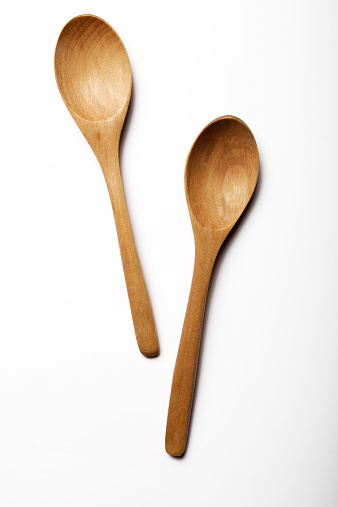 Wooden spoon on white backgrounds.