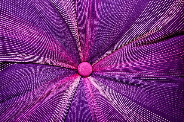istock Covered Pink Button at Center of Scatter Cushion 524948811