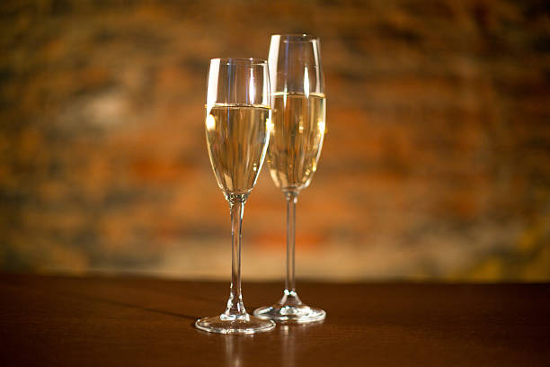 istock Two champagne glasses on wood 524998039