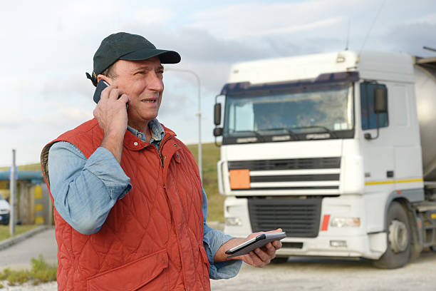 istock Truck Driver W Smart Phone and Tablet 524998563