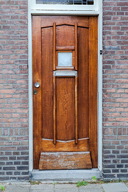 istock Old looking, light brown wooden door 525000595