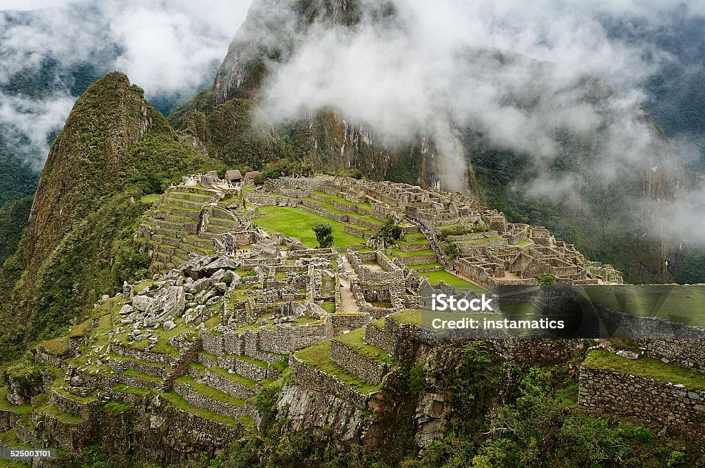 Machu Picchu in Peru Machu Picchu during a cloudy morning Ancient Stock Photo