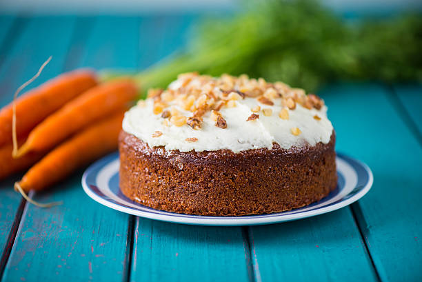 Traditional homemade  carrot cake and fresh carrots stock photo