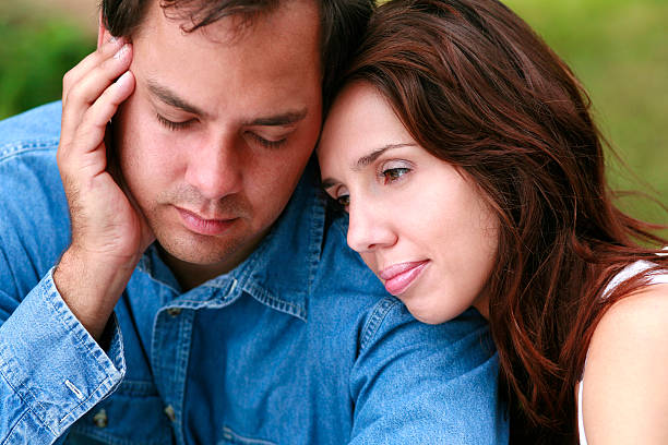 istock Young couple outdoors looking worried. 525013548