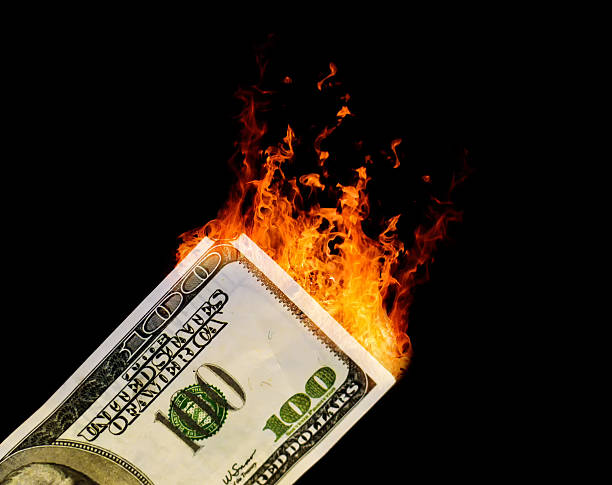 istock Hundred Dollar USA Bill Catching on Fire 525015098