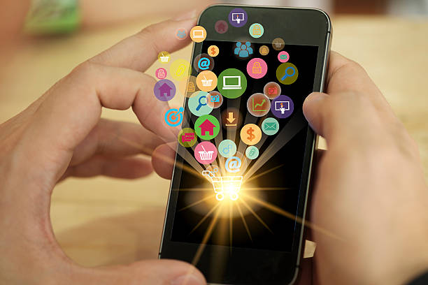 istock shopping cart with application software icons on mobile , busine 525016434