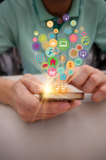 istock shopping cart with application software icons on mobile , busine 525016732
