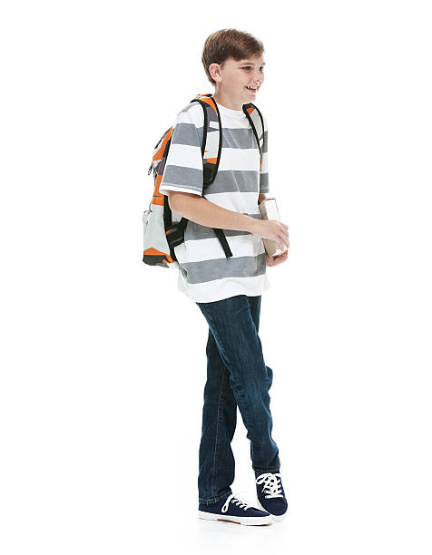 istock Smiling little boy standing and looking away 525017200