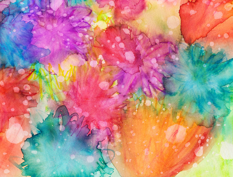 An hand painted background with watercolors and ink. There is texture from paint pooling and splatters. There are a variety of colors including pink, blue, red, orange and more. The subtle shapes almost resemble abstract flowers.