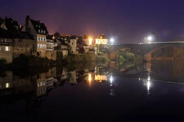 Argentat city, bridge and floating river Dordogne by night