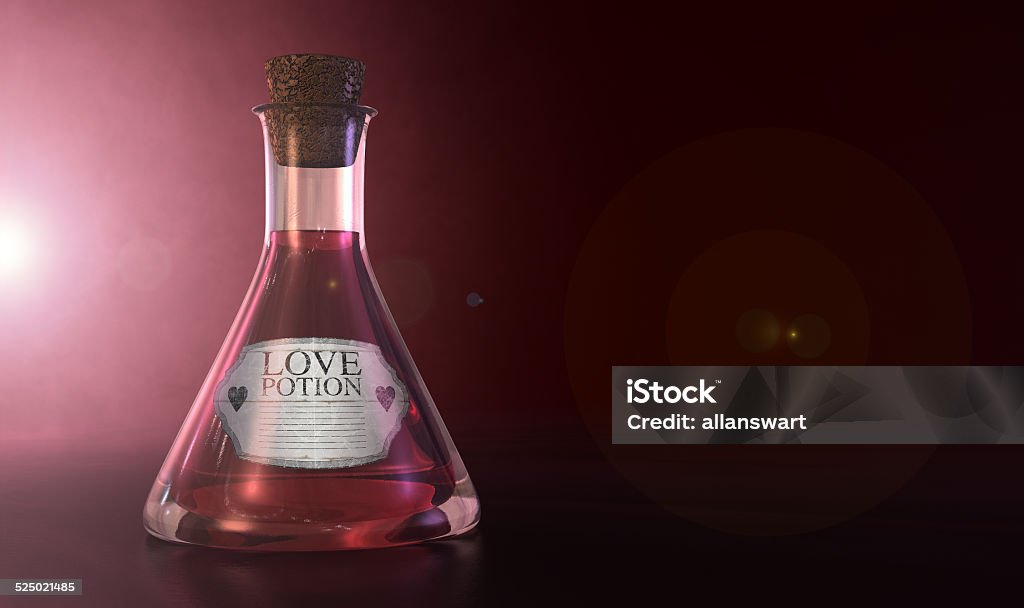 Love Potion A regular old goblet glass bottle filled with a pink liquid with a label showing it is love potion and sealed with a cork on a spotlit pink background Community Stock Photo