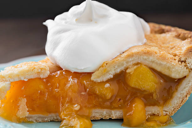 istock Slice Of Golden Peach Pie 525022983