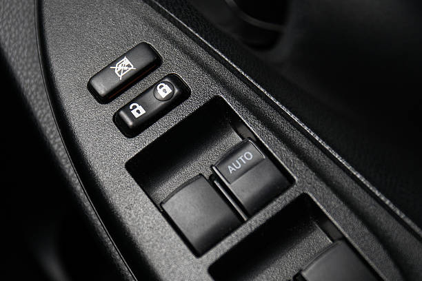 istock Car Door Lock Button Closeup. Electric Locking Button in Modern 525023024