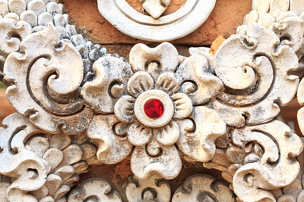 istock Low relief cement thai style handcraft of thai temple. 525023454