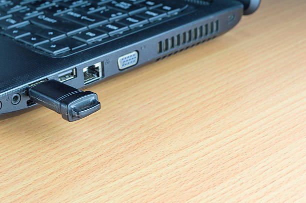 istock Flash memory drive plugged into a laptop port 525025632