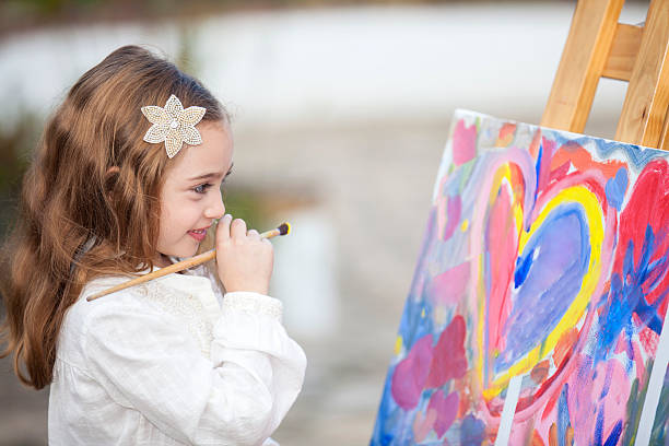 istock Little artist creating a painting 525026712