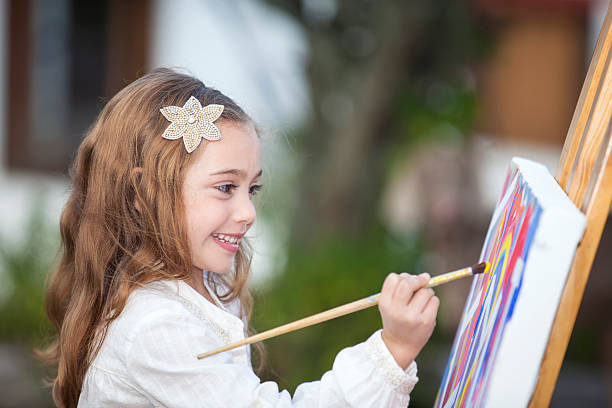 istock Little artist creating a painting 525026778