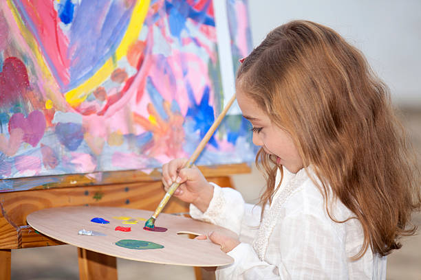 istock Little artist creating a painting 525027054