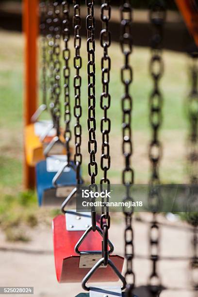 Empty Colorful Swings At The Park Stock Photo - Download Image Now - Playground, Swing - Play Equipment, Absence