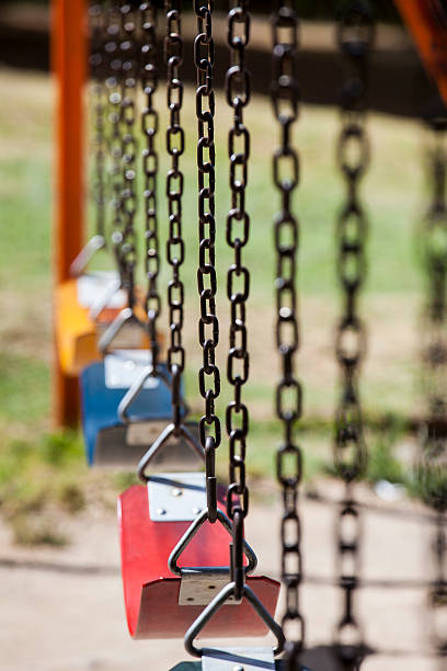 пустые красочные движения на парк - swing playground empty abandoned стоковые фото и изображения