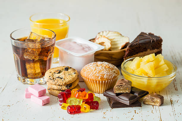 Selection of food high in sugar Selection of food high in sugar, copy space sugar food photos stock pictures, royalty-free photos & images