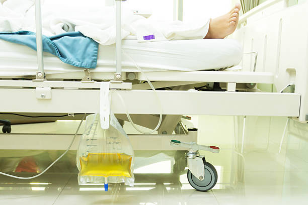 urine collection bag plastic urine collection bag hang under patient bed in hospital catheter photos stock pictures, royalty-free photos & images