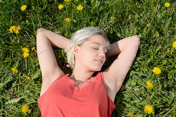 istock woman on flower meadow 525032154