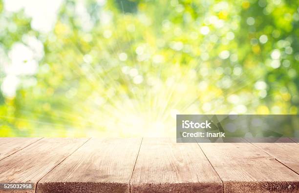 Empty Wooden Table Planks Green Blurred Trees Background Stock Photo - Download Image Now